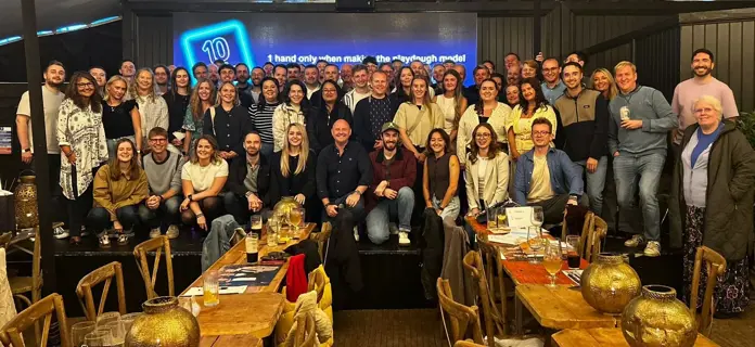 Group photo of all of the Rappor employees at a dinner event
